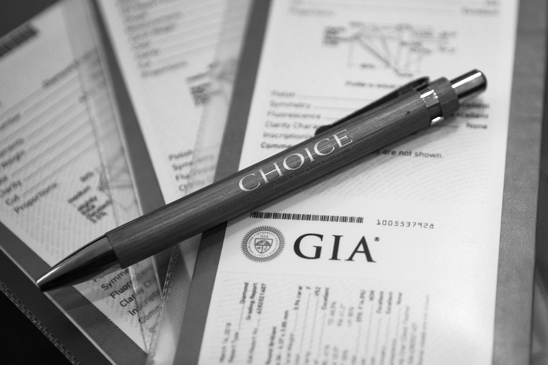 A GIA diamond grading report on a desk