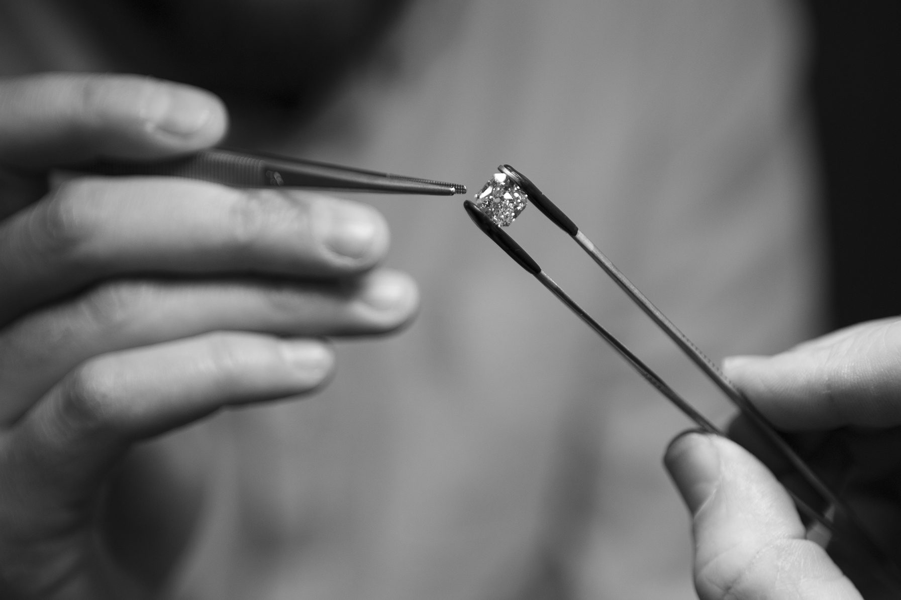 Tweezers holding a polished diamond